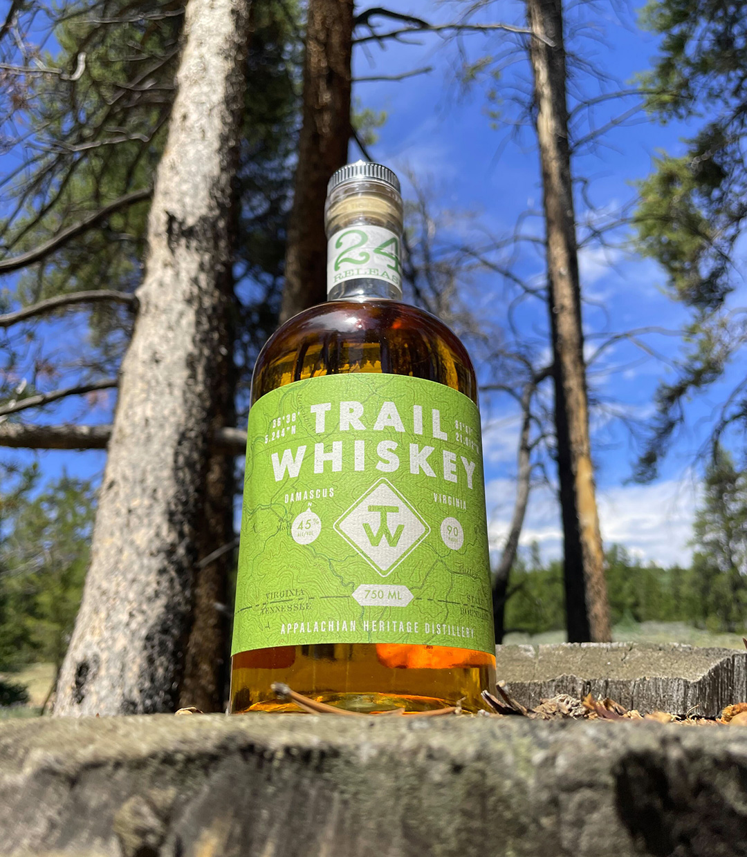 Trail Whiskey bottle on trail